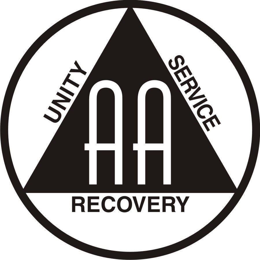 The Alcoholics Anonymous logo, two capital A's in a black triangle. On each side of the triangle is written 'Unity', 'Service' and 'Recovery'. The triangle is enclosed in a black circle outline.