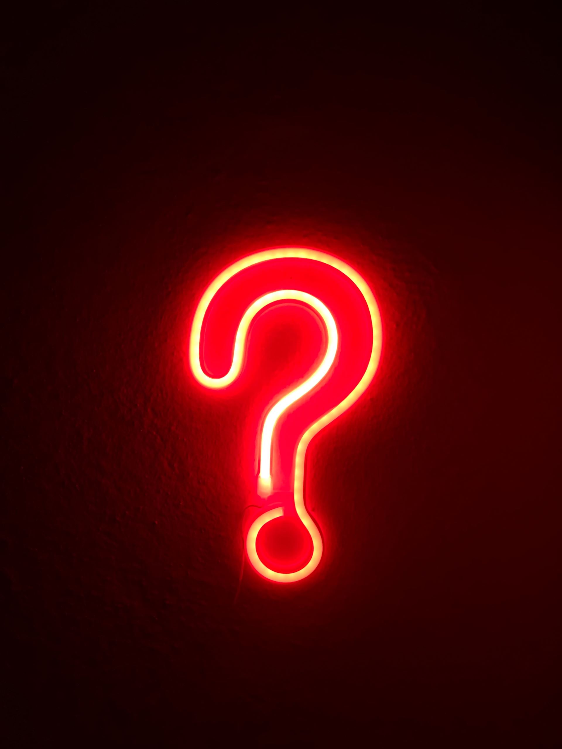 A question mark made from a neon light